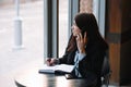 businesswoman talking on the phone and taking notes Royalty Free Stock Photo