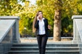 Businesswoman talking on phone while walking outdoor Royalty Free Stock Photo