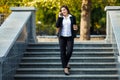 Businesswoman talking on phone while walking outdoor Royalty Free Stock Photo