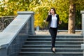 Businesswoman talking on phone while walking outdoor Royalty Free Stock Photo