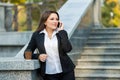 Businesswoman talking on phone while walking outdoor Royalty Free Stock Photo