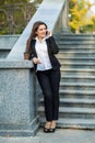 Businesswoman talking on phone while walking outdoor Royalty Free Stock Photo