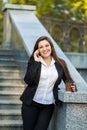 Businesswoman talking on phone while walking outdoor Royalty Free Stock Photo