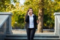 Businesswoman talking on phone while walking outdoor Royalty Free Stock Photo