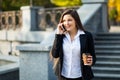 Businesswoman talking on phone while walking outdoor Royalty Free Stock Photo