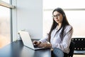 Businesswoman talking on the phone while working on her computer Royalty Free Stock Photo