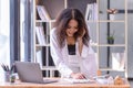 Businesswoman talking on the smartphone in the office