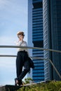 Businesswoman walks next to office building Royalty Free Stock Photo