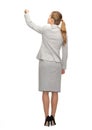 Businesswoman or teacher with marker from back Royalty Free Stock Photo