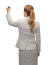 Businesswoman or teacher with marker from back Royalty Free Stock Photo