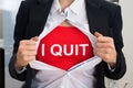 Businesswoman Tearing Off Shirt With I Quit Sign