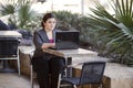 Businesswoman - Telecommuting from Internet Cafe Royalty Free Stock Photo