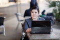 Businesswoman - Telecommuting from Internet Cafe Royalty Free Stock Photo