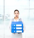 Businesswoman terrified hold stack folder