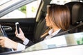 Businesswoman texting and driving