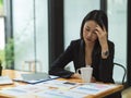 Businesswoman thinking and stressing out about business plan