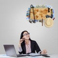 Businesswoman thinking about traveling Royalty Free Stock Photo
