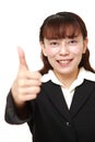 Businesswoman with thumbs up gesture