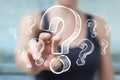 Businesswoman touching and holding hand drawn question marks Royalty Free Stock Photo
