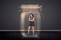 Businesswoman trapped into a glass jar concept Royalty Free Stock Photo