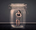 Businesswoman trapped into a glass jar concept Royalty Free Stock Photo