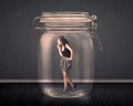 Businesswoman trapped into a glass jar concept Royalty Free Stock Photo