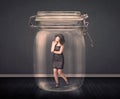 Businesswoman trapped into a glass jar concept Royalty Free Stock Photo