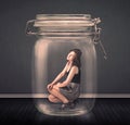 Businesswoman trapped into a glass jar concept Royalty Free Stock Photo