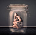 Businesswoman trapped into a glass jar concept Royalty Free Stock Photo