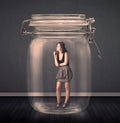 Businesswoman trapped into a glass jar concept Royalty Free Stock Photo