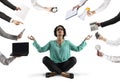 Businesswoman tries to keep calm with yoga due to stress and overwork at wok Royalty Free Stock Photo