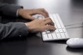 Businesswoman typing at computer