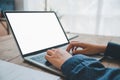 businesswoman is typing on her laptop at work, searching or transacting online, and working on her finance business Royalty Free Stock Photo