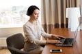 Businesswoman typing on laptop at hotel room Royalty Free Stock Photo