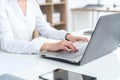 Businesswoman typing on laptop at workplace Woman working in office hand keyboard