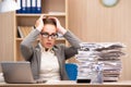 The businesswoman under stress from too much work in the office Royalty Free Stock Photo
