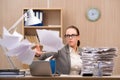 The businesswoman under stress from too much work in the office Royalty Free Stock Photo