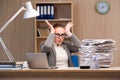 The businesswoman under stress from too much work in the office Royalty Free Stock Photo