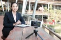 Businesswoman use smartphone for online live streaming. woman re Royalty Free Stock Photo