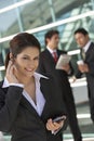 Businesswoman Using Cell Phone Outside Office Royalty Free Stock Photo