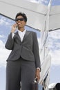 Businesswoman Using Cellphone At Airfield Royalty Free Stock Photo