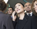 Businesswoman Using Cellphone In Crowd On Train Royalty Free Stock Photo