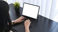 Businesswoman using computer tablet searching information online at office desk. Royalty Free Stock Photo