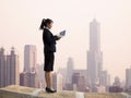 Businesswoman using computer and wireless access