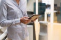 Businesswoman using digital tablet in the corridor at office Royalty Free Stock Photo