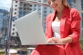 Businesswoman using laptop on city street Royalty Free Stock Photo