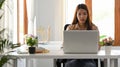 Businesswoman using laptop computer in her office workplace Royalty Free Stock Photo