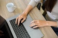 A businesswoman using laptop computer, typing on keyboard. top view, close-up hands image Royalty Free Stock Photo