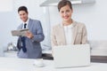 Businesswoman using a laptop while having breakfast Royalty Free Stock Photo