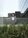 Businesswoman Using Laptop Outside Buildings Royalty Free Stock Photo